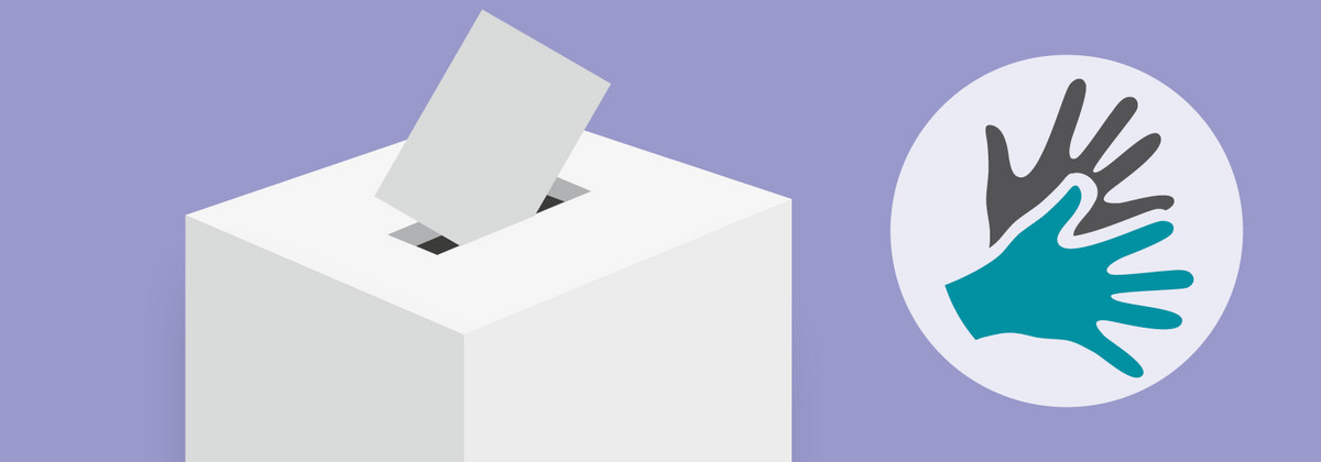 Eine Wahlurne mit zusammengefaltetem Wahlzettel in der Öffnung, daneben das Zeichen für DGS: Zwei gebärdende Hände