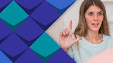 Workshop in Deutscher Gebärdensprache. Die Frau zeigt die Buchstabe L mit dem Hand.